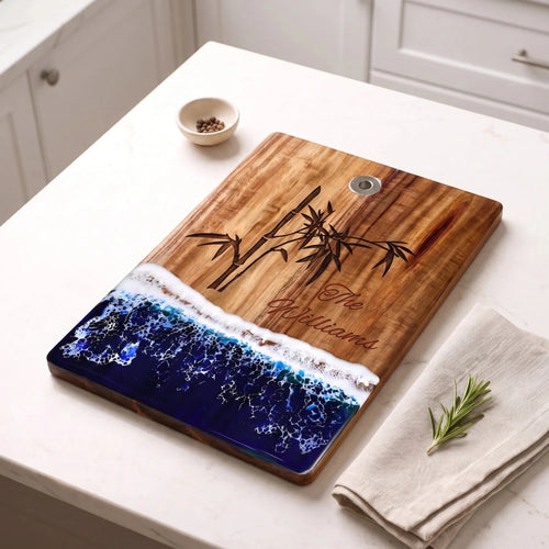 Custom_engraved_bamboo_motif_resin_cutting_board_angled_kitchen