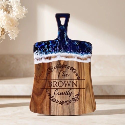 Custom_family_name_coastal_blue_epoxy_cheese_board_front_view