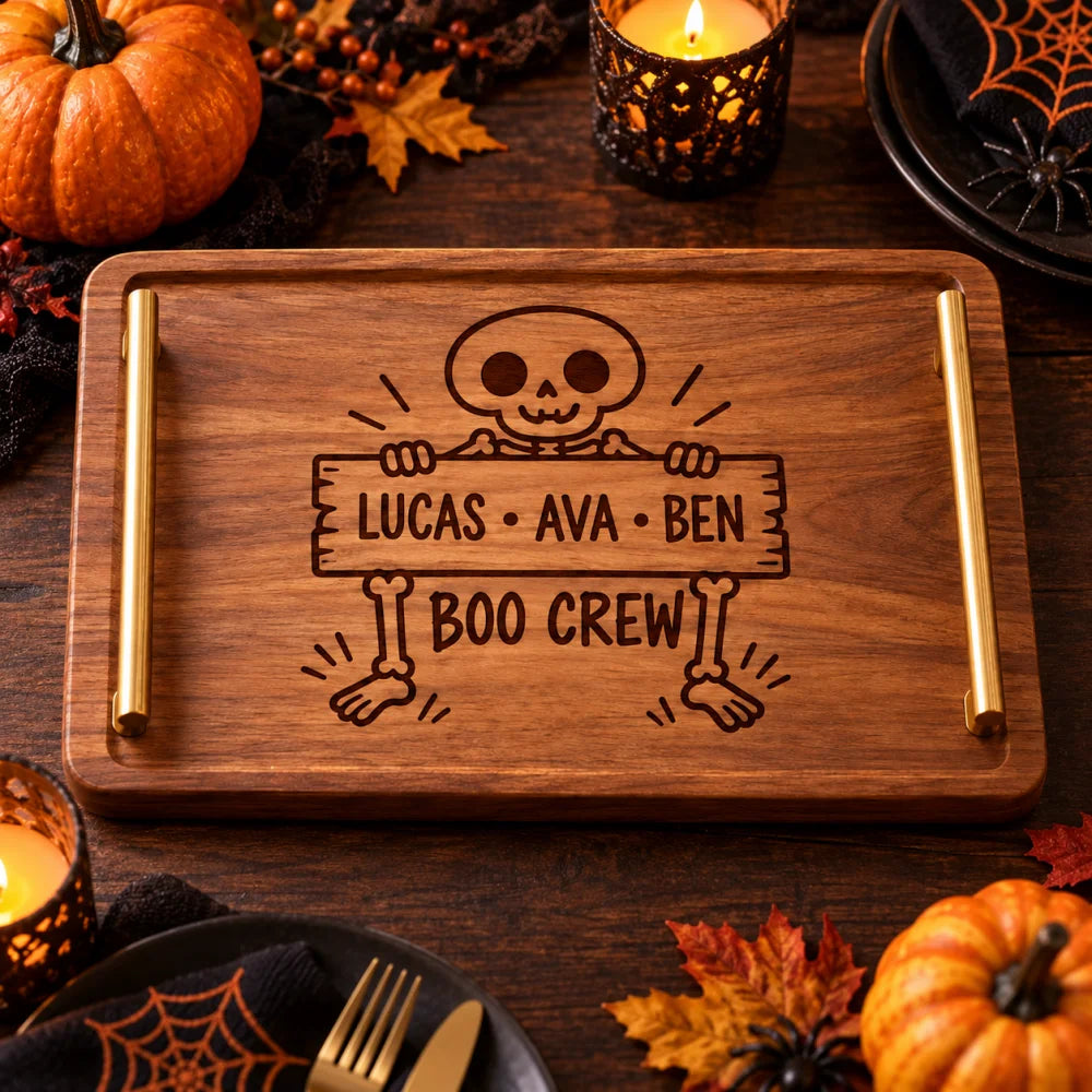Empty_wooden_tray_with_skeleton_boo_crew_engraving_on_dark_table
