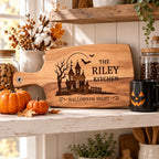 Halloween_haunted_house_engraved_board_on_kitchen_shelf_with_pumpkins