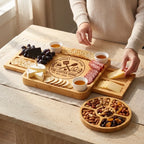 Woman_arranging_cheese_and_meat_on_Halloween_spooky_good_food_expandable_board