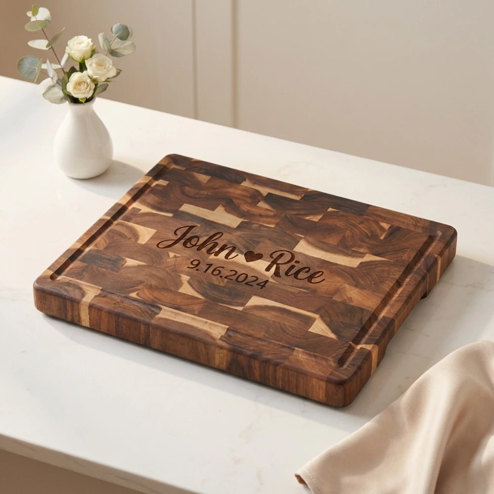 engraved_end_grain_board_flat_on_marble_counter_with_roses